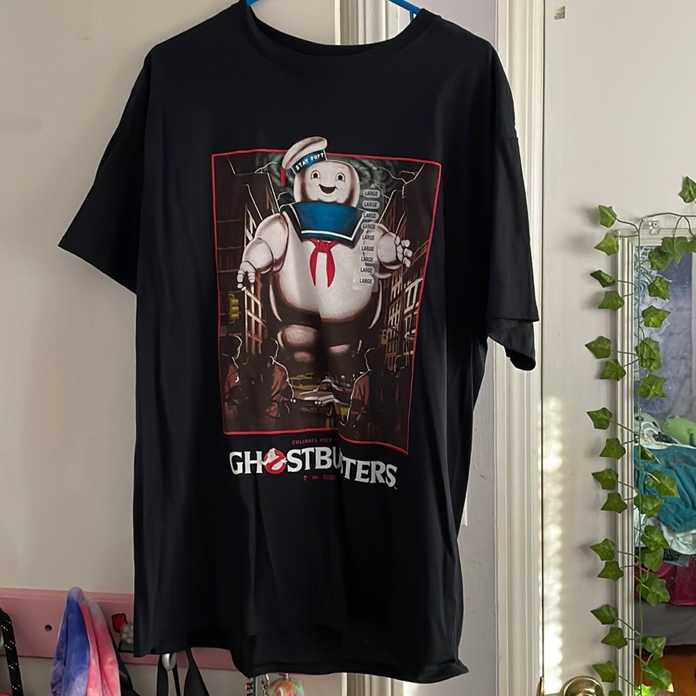 This is a kids graphic tee. It’s a size Large. Never worn. Tags still on.